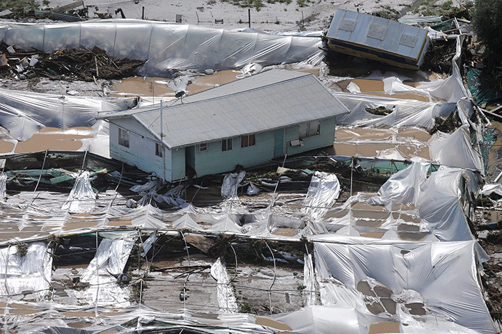 Brisbane floods: A house finds its resting place after floating in floodwaters in Grantham