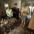 Brisbane floods: Helen and Trevor Goschnick mop up the aftermath of a metre of floodwaters