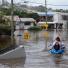 Brisbane floods: A fridge floats down the street in the  suburb of Rosalie in Brisbane