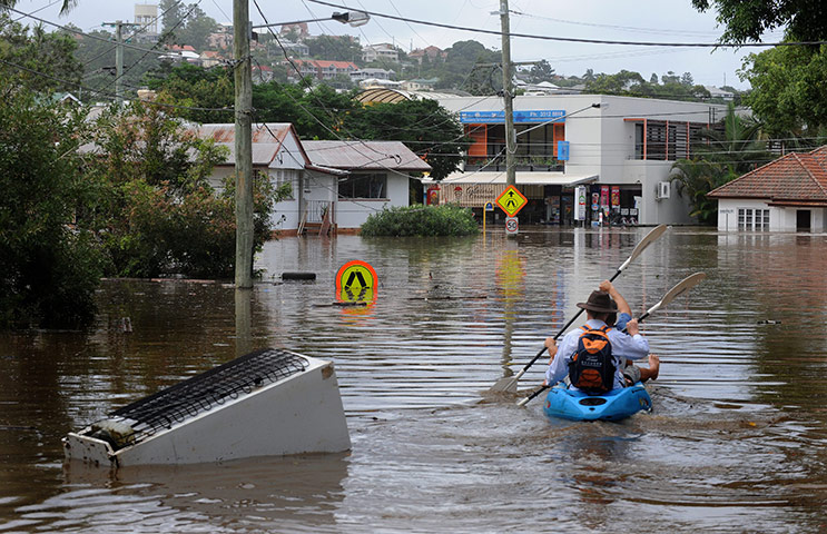 Brisbane floods: A fridge floats down the street in the  suburb of Rosalie in Brisbane