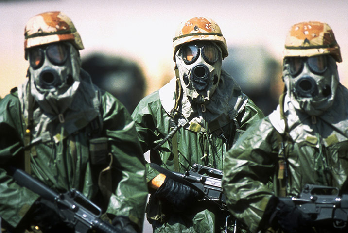 Gulf War: April 18, 1991: US soldiers in gas masks during Operation Desert Shield