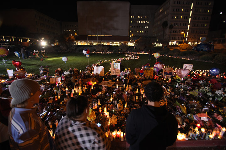 Tuscon shooting: People gather at a makeshift memorial at the University Medical Centre