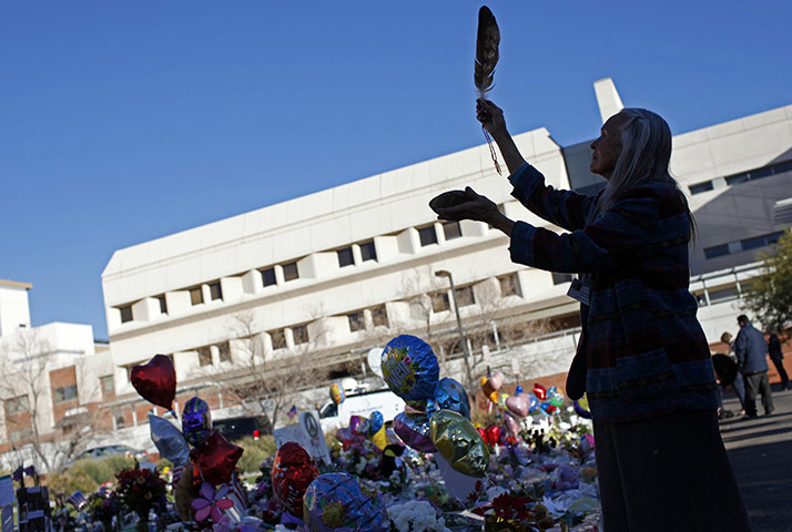 Tuscon shooting: Native American traditional practitioner spreads incense at a memorial