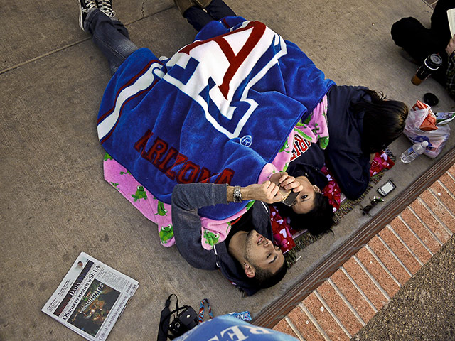 Tuscon shooting: People wait to see President Obama speak at McKale Centre in Tucson