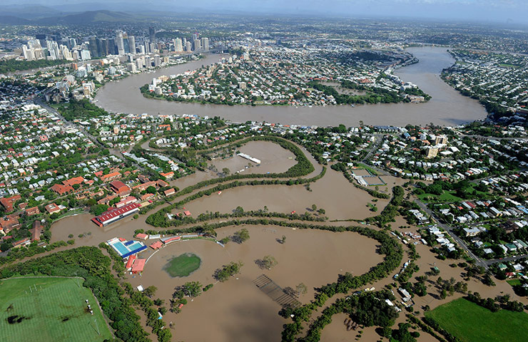 Aerials Brisbane floods: The swollen Brisbane River inundates the inner city suburb of East Brisbane