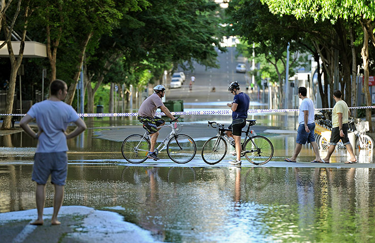 Aerials Brisbane floods: Residents survey the near-deserted city centre 