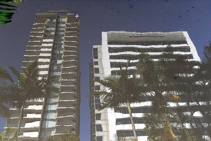 Aerials Brisbane floods: Apartments and office buildings are reflected in flood waters in Brisbane