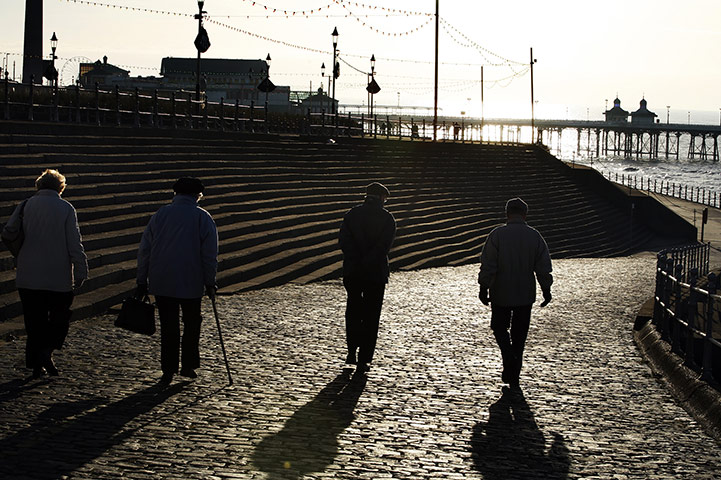 Week in business: People walk along the promenade in Blackpool