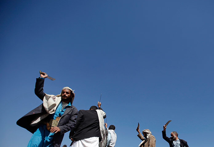 24 hours in pictures: Tribesmen perform the traditional Baraa dance in Wadi Dhahr
