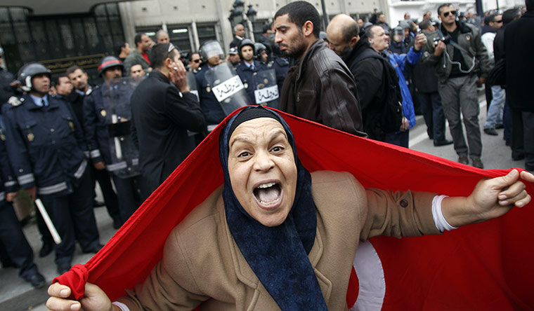 protests in tunisia: A protester with a Tunisian flag