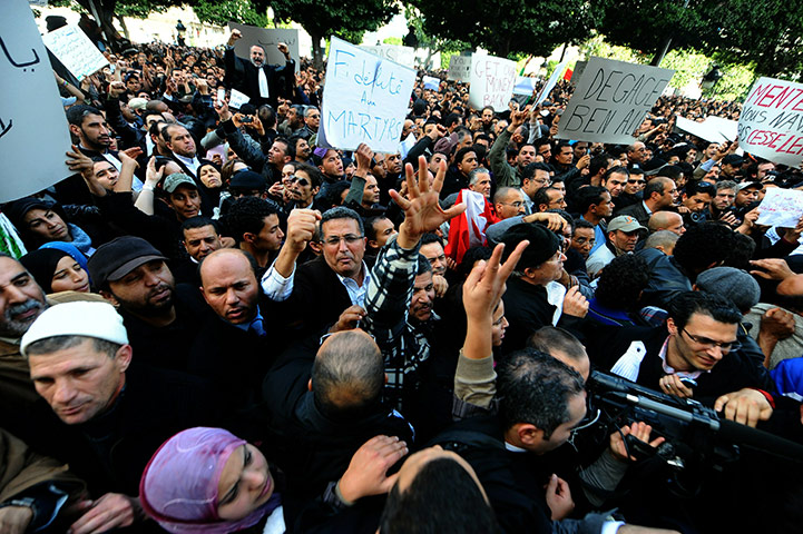 protests in tunisia: Tunisian demostrators shout slogans
