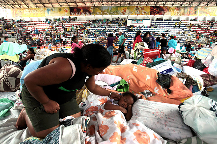 brazil mudslide aftermath: Displaced people seek shelter in a sports hall in Teresopolis