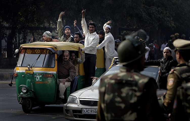 24 Hours: Muslims arrive to offer prayers at the site of a razed Mosque in New Delhi