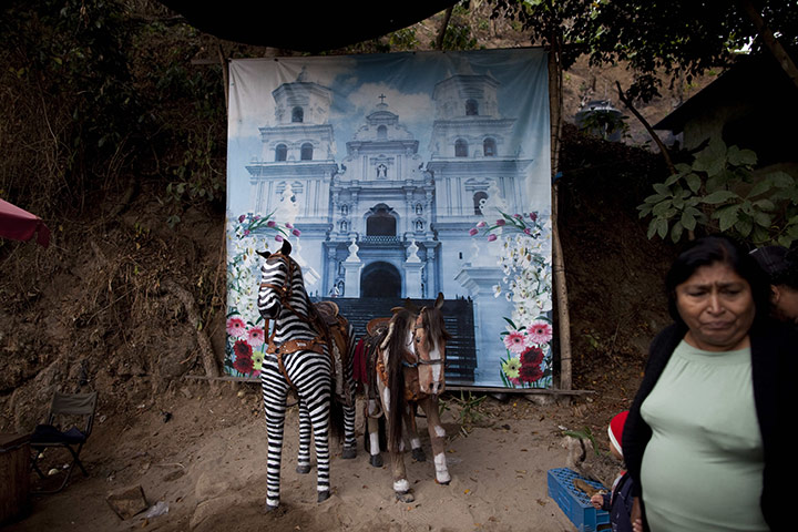 24 Hours: A photo studio with a background photograph of the Black Christ Basilica