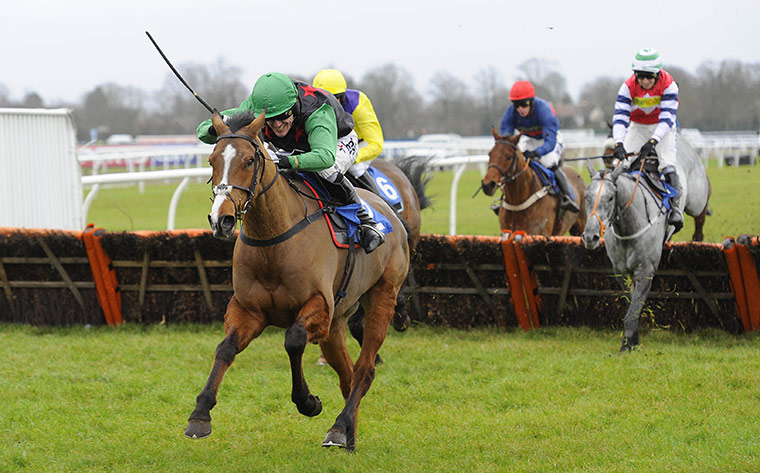 King George VI: Tony McCoy drives Ski Sunday on to win the William Hill handicap hurdle