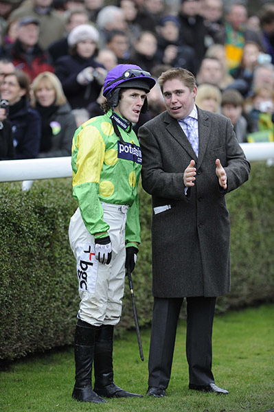 King George VI: Tony McCoy gets advice from Dan Skelton, assistant trainer to Paul Nicholls