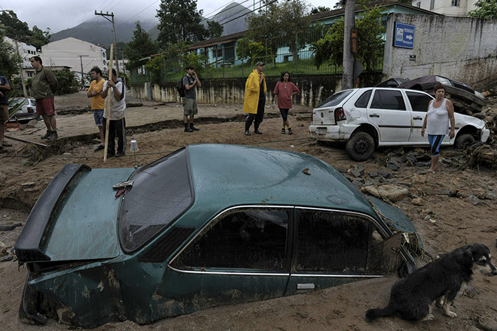 Brazil aftermath: Residents talk in a destroyed street in downtown Nova Friburgo