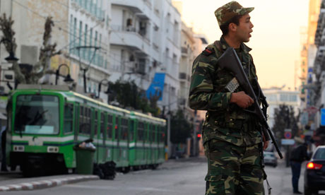 A Tunisian army soldier patrols downtown in Tunis