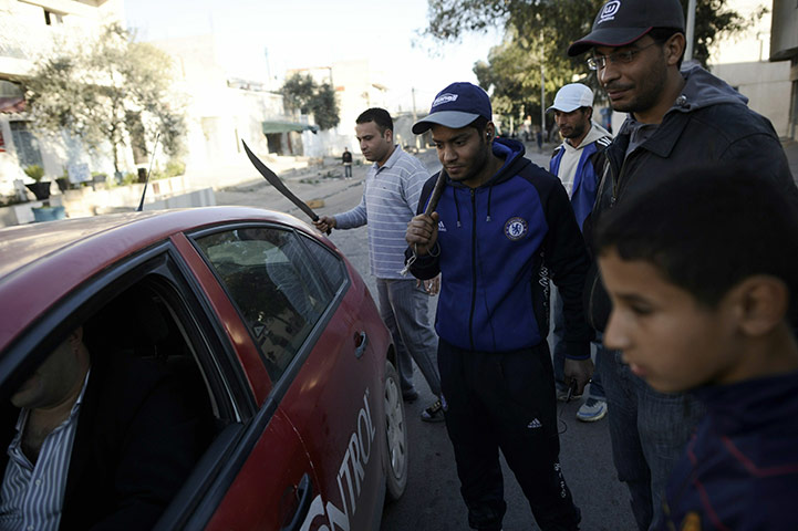 Tunisia: Residents check cars in Tunis 