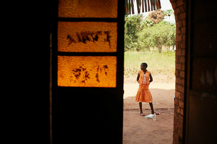 Sudan election: A girl stands outside of a church in Yambio