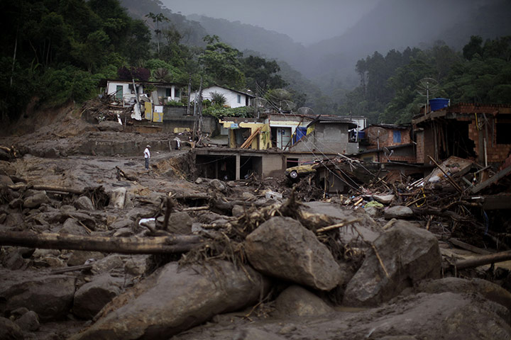 Felipe Dana in Brazil: A man stands among debris after a landslide in Teresopolis, Brazil