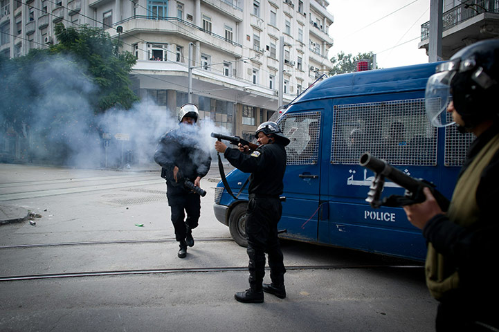 Tunis protest: Policemen shoot teargas shells towards protesters in Tunis