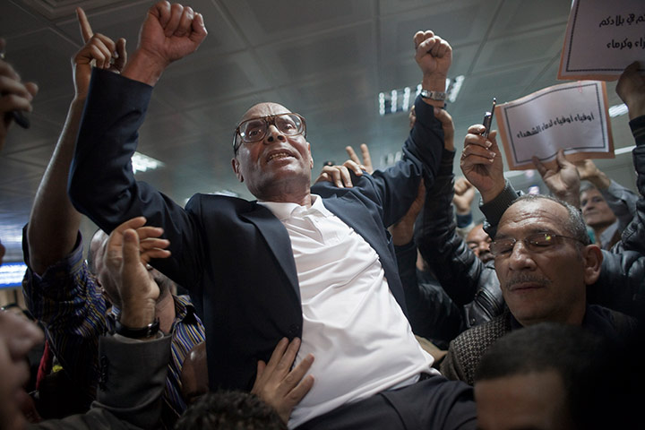 Tunis protest: Tunisian opposition figure Moncef Markouzi celebrates