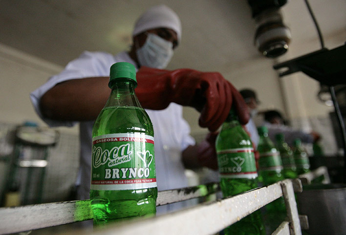 Coca products: A worker screws on the cap on a bottle of Coca Brynco by Soda Pacena