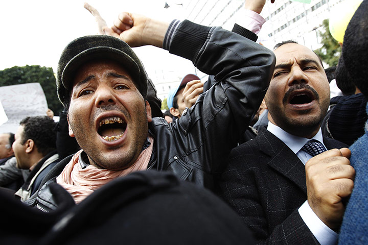 Tunisia uprising: A protester shouts during a demonstration in downtown Tunis