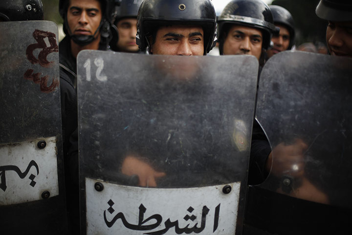 Tunisia uprising: Riot police stand ready during a demonstration in downtown Tunis