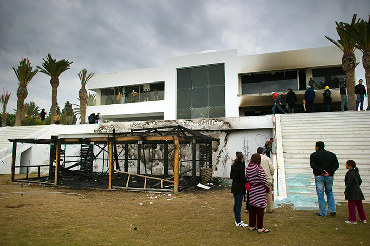Tunisia uprising: People visit the burnt and looted house of Ben Ali's nephew