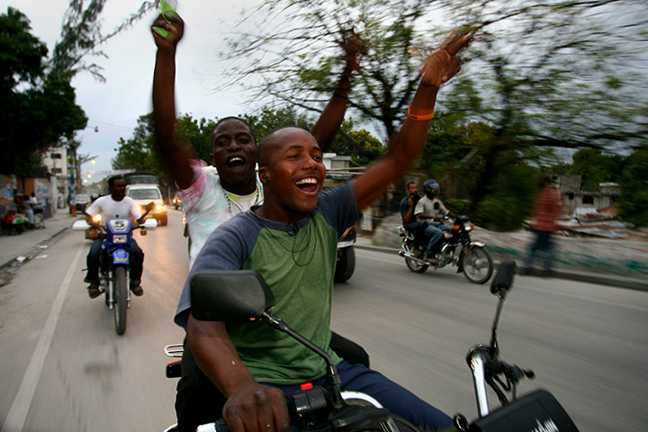 24 hours in pictures: Supporters follow of Baby Doc Duvalier in Haiti