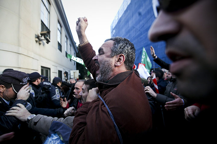 24 hours in pictures: Police officers clash with demonstrators in Lisbon