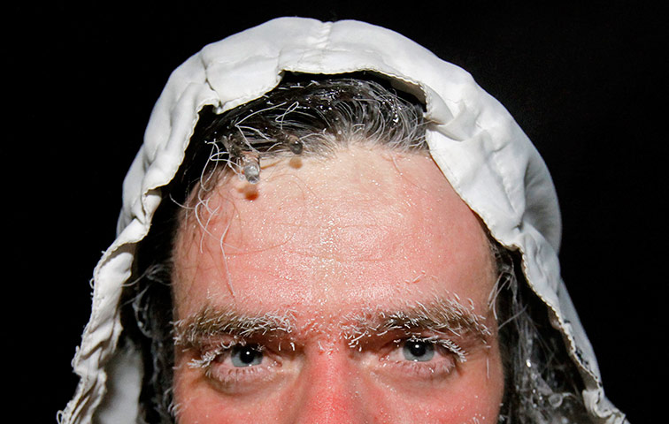 Orthodox epiphany: A man looks on after emerging from icy waters during Orthodox Epiphan