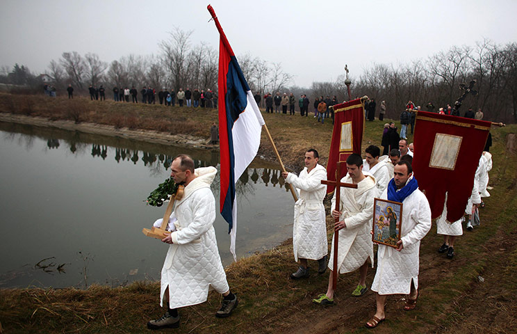 Orthodox epiphany: Believers hold a religious service, before swimming in Markovacko Lake