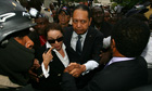 Jean-Claude 'Baby Doc' Duvalier and Veronique Roy leave court