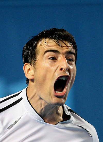 Australian Open Day 3: Ivan Dodig celebrates winning a point