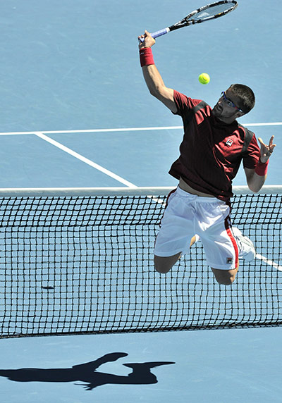 Australian Open Day 3: Janko Tipsarevic trys to return the ball against Fernando Verdasco