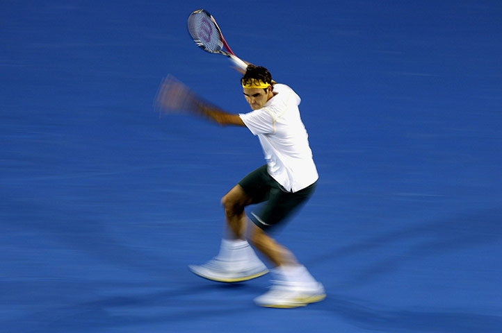 Australian Open Day 3: Roger Federer plays a forehand return to Gilles Simon