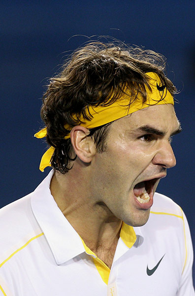 Australian Open Day 3: Roger Federer celebrates his victory over Gilles Simon