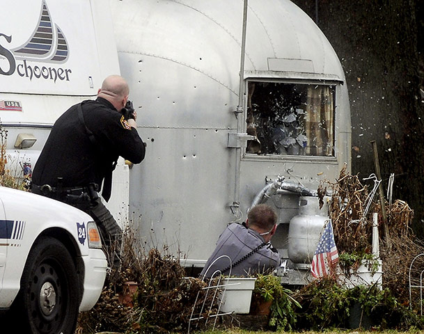 24 hours in pictures: Enon Beach, Ohio: Police open fire on a trailer during a shootout