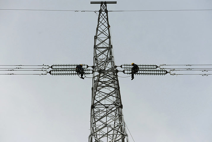 24 hours in pictures: Workers install a new electricity pylon in Chuzhou