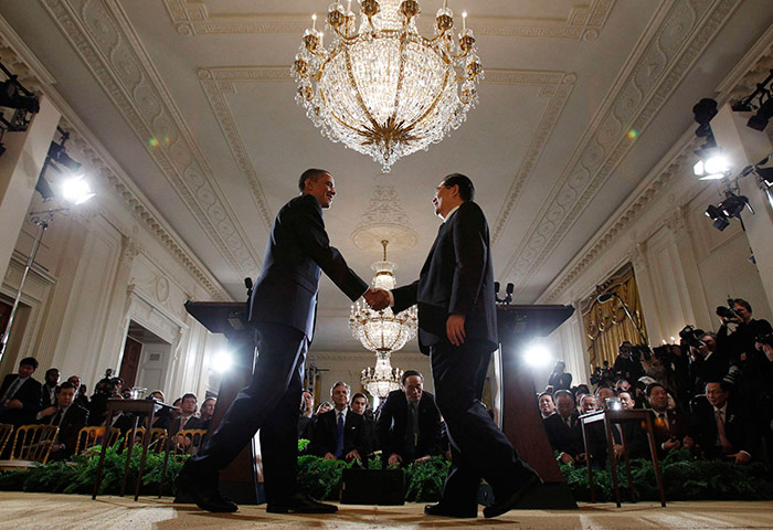 Hu Jintao in Washington: Barack Obama shakes hands with Hu Jintao after a joint news conference 
