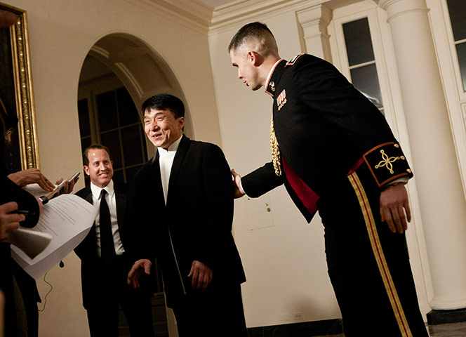 Hu Jintao in Washington: A Marine ushers action film star Jackie Chan through the White House