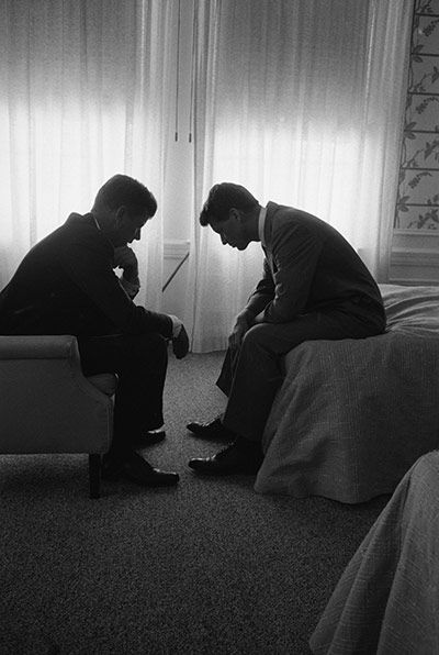 JFK Anniversary: Pres cand Jack Kennedy conferring head-to-head w his brot