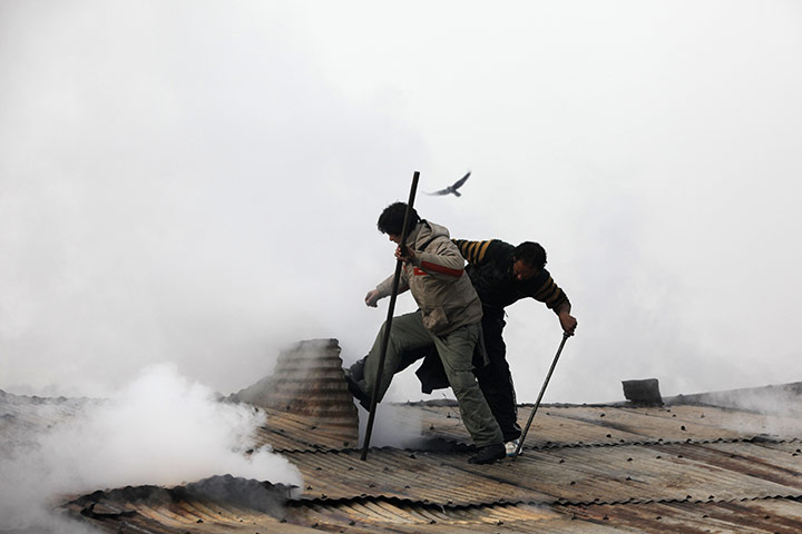 24 hours in pictures: fire in Srinagar, India