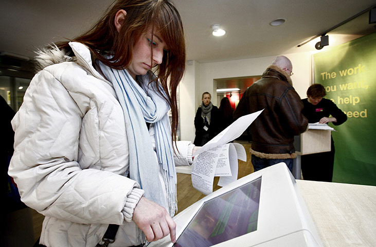 Week in business: A job seekers searches for job vacancies at a job centre