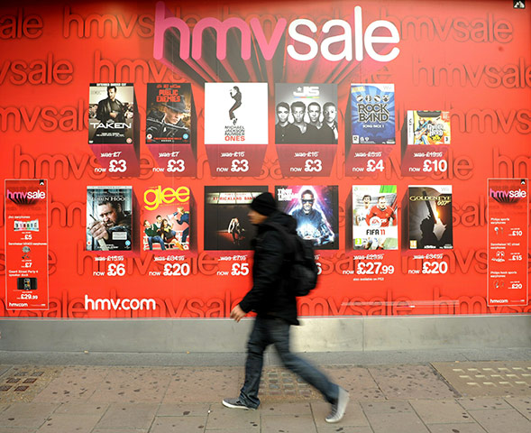 Week in business: A shopper walks past an HMV store on Oxford Street 