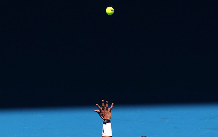 Melbourne Tennis Day 4: Rafael Nadal throws the ball up to serve
