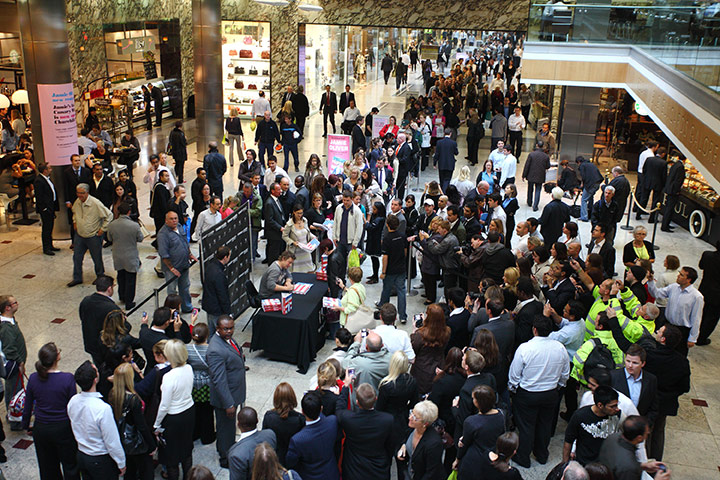 Week in business: Jamie Oliver signs his book Jamie's America in London